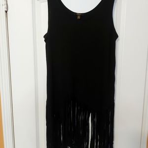 Black tank top with fringes at length.